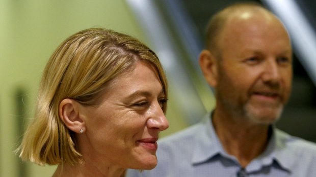 60 Minutes presenter Tara Brown and producer Stephen Rice arrive at Sydney Airport.