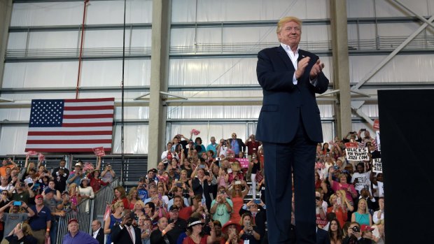President Donald Trump waits to speak at his "Make America Great Again Rally" at Orlando-Melbourne International Airport in Melbourne, Florida.