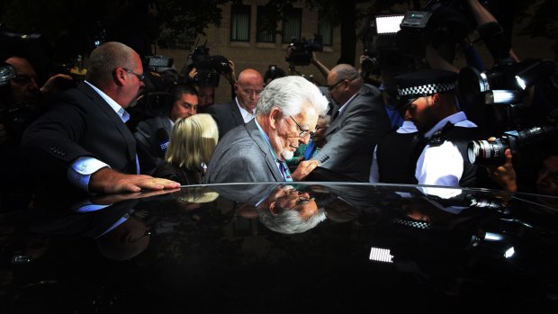 Rolf Harris leaves Southwark Crown Court in London during his 2014 trial.