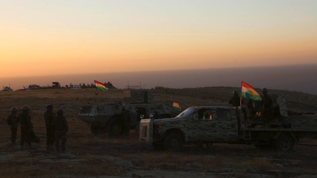 A peshmerga convoy drives towards a frontline in Khazer, about 30 kilometers east of Mosul, Iraq.