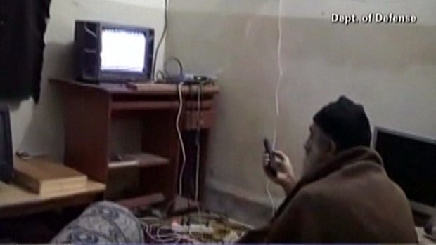 This grab from an undated video released by the US Department of Defence reportedly shows Al-Qaeda leader Osama bin Laden watching television at his compound in Abbottabad, Pakistan. Numerous documents and books that were taken by the Navy SEALs that killed him here have been released.