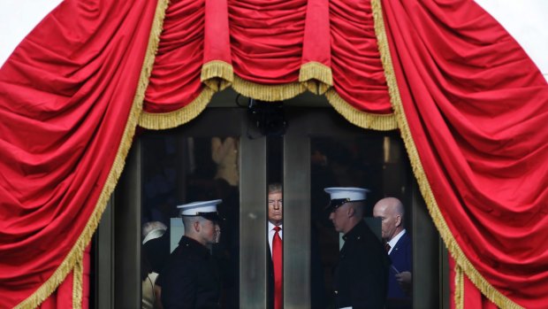 Donald Trump waits to step out onto the portico for his inauguration on January 20, 2017.