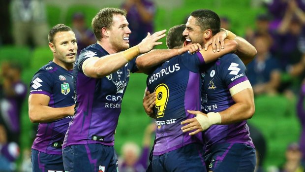 Cameron Smith and his Storm teammates celebrate a try.