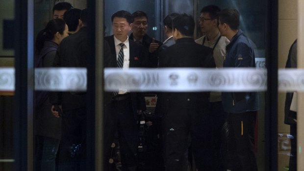 North Korean officials arrive at the VIP area at Beijing Capital International Airport, after landing on a flight from Kuala Lumpur on Friday.