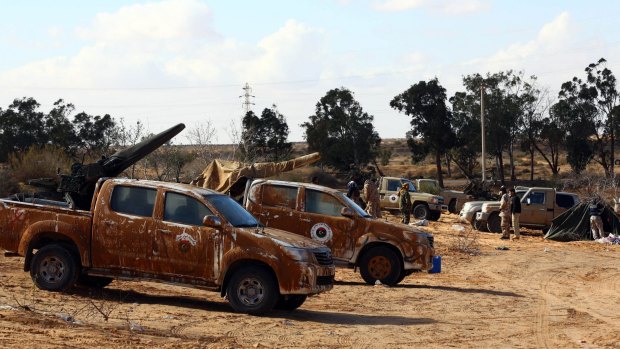 Fighters from the Libya Dawn movement assemble near the Wetia military air base, 170 kilometres west of the capital Tripoli.