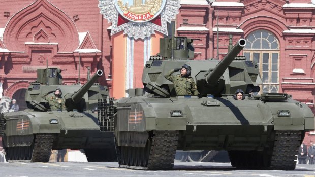 Russian servicemen drive T-14 Armata tanks during a rehearsal for the Victory Day parade in Red Square.