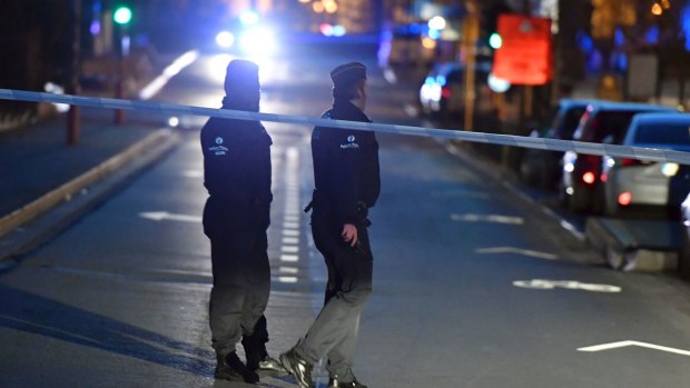 Police officers at a cordon during the investigation of a suspect car in the centre of Brussels.