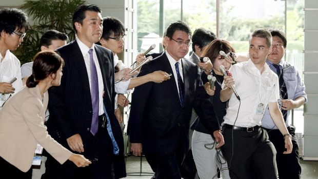 Japanese Foreign Minister Taro Kono, centre, arrives at prime minister's official residence in Tokyo on Friday morning.