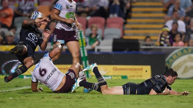 Sliding over: Lachlan Coote scores a try during the round 16 NRL match between the North Queensland Cowboys and the Manly Sea Eagles at 1300SMILES Stadium.