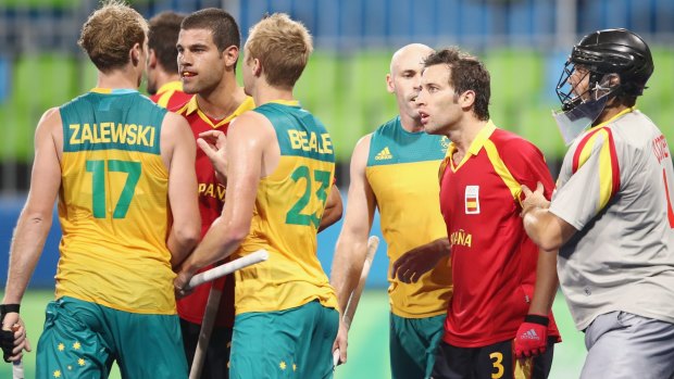 Australians Aran Zalewski and Daniel Beale exchange heated words with Salvador Piera of Spain during their match against Spain