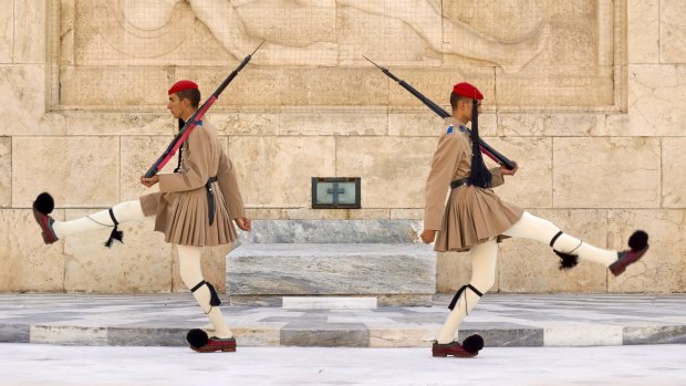 CHANGING OF THE GUARDS, ATHENS, GREECE. Each morning at 11am at the Tomb of the Unknown Soldier in Syntagma Square, guards in kilts and pompom shoes act out the world's strangest guard change, memorably described by the Berlitz guide as akin to the mating dance of eccentric ostriches. 