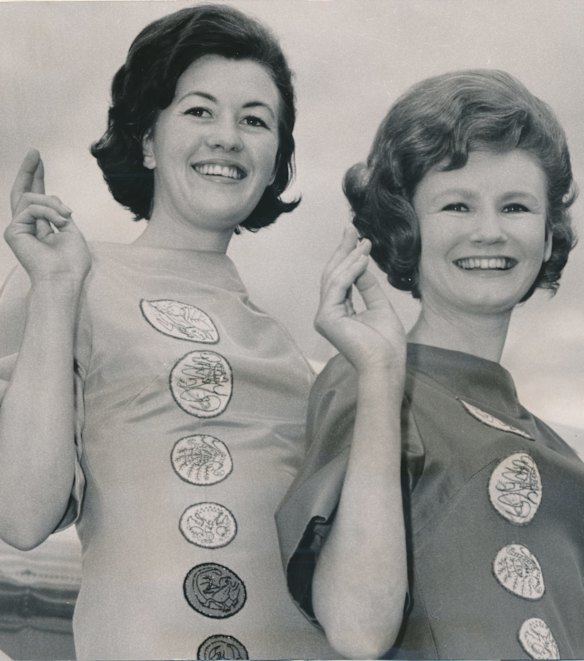 The 'Dollar Girls'. Megan Haslingden, 24 and Carolyn Osborne, 21,  arrive at Melbourne Airport wearing "currency" dresses. 