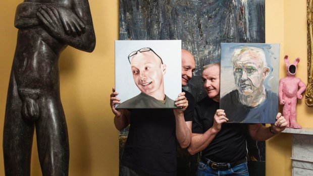 In the living room: Michael Eyes and Gordon Elliott with a 250-kilo  Terry Stringer statue and <i>Thor</i> by Euan MacLeod. Eyes holds Juan Ford's <i>Portrait Of Michael</i>, Elliott holds MacLeod's <i>Gordon I</i> and Todd Fuller's <i>Pinkie</i> sits on the mantel.