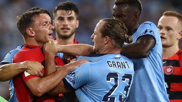Flashpoint: Brendon Santalab clashes with Rhyan Grant during the fiery clash at ANZ Stadium.