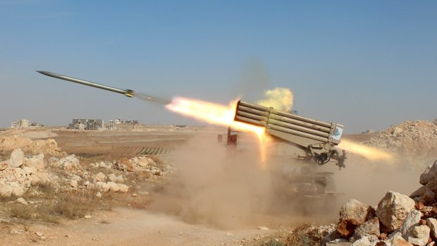 Syrian rebels fire missiles on Assad regime forces near Baskoy village in Aleppo. 