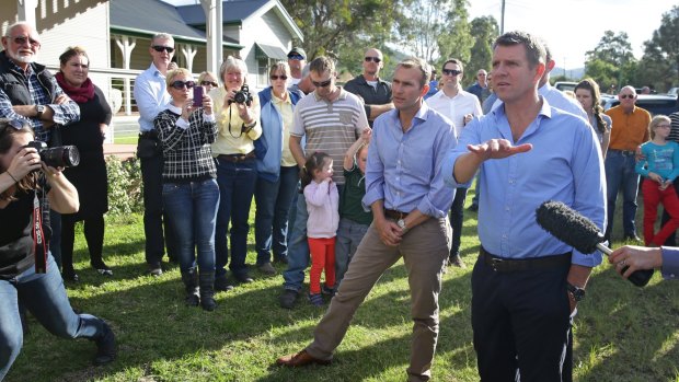 NSW Premier Mike Baird (with Planning Minister Rob Stokes, left) talks to locals in Bulga.  