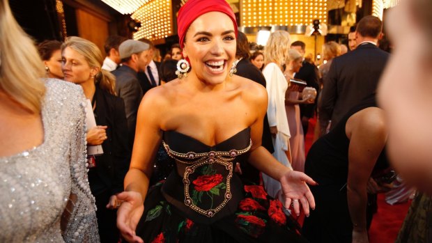 Divide and conquer ... Olympia Valance in a Spanish-themed ball gown.