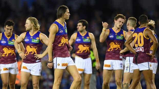 Lions players look dejected after losing the round five AFL match against the Western Bulldogs on Saturday.