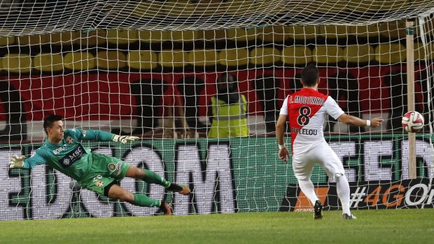 Spot on: Monaco's Joao Moutinho scores a penalty against Evian Thonon Gaillard's goalkeeper Jesper Hansen.