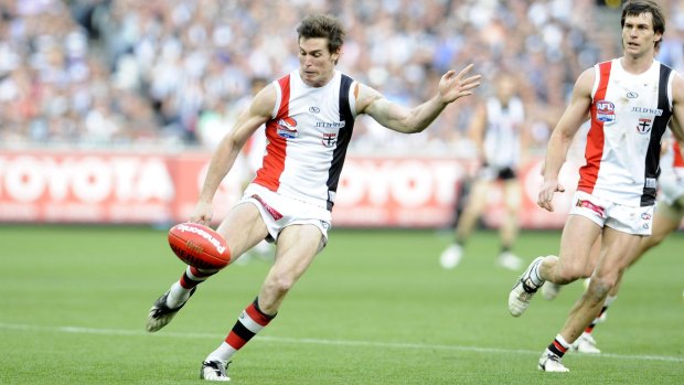 So close: Lenny Hayes kicks a point to draw the grand final