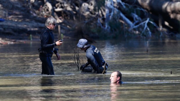 Divers searching for the child's body at the Murray River near Moama.
