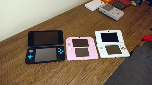 The New 2DS XL alongside its smaller brothers, the original 2DS and the New 3DS.