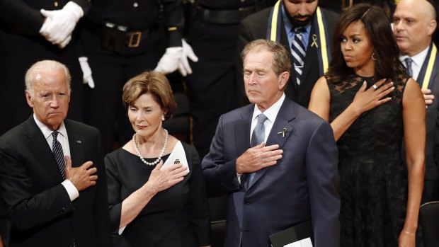 From left, Vice-President Joe Biden, Laura Bush, former president George W. Bush and first lady Michelle Obama at service in Dallas.