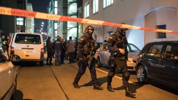 Special Unit Policemen secure the area in front of the Islamic centre in Zurich.