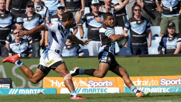 Catch me if you can: Ben Barba goes in to score for the Sharks.