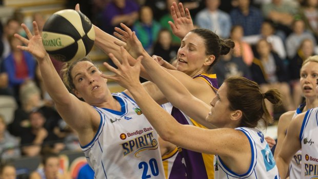 My ball: Gabe Richards, Elyse Penaluna, Belinda Snell and Kelly Wilson scramble for a loose ball under the basket. 