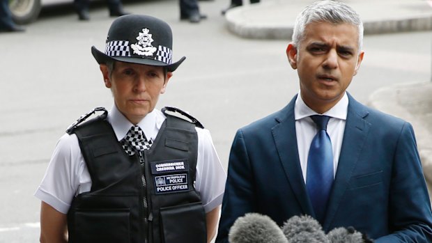 Mayor of London Sadiq Khan (right) talks to reporters alongside London Police Commissioner Cressida Dick (left). 