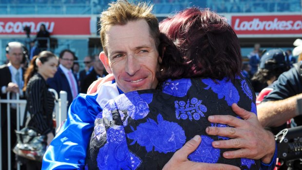 Satisfied: Hugh Bowman hugs part owner Debbie Kepitis after his winning ride.