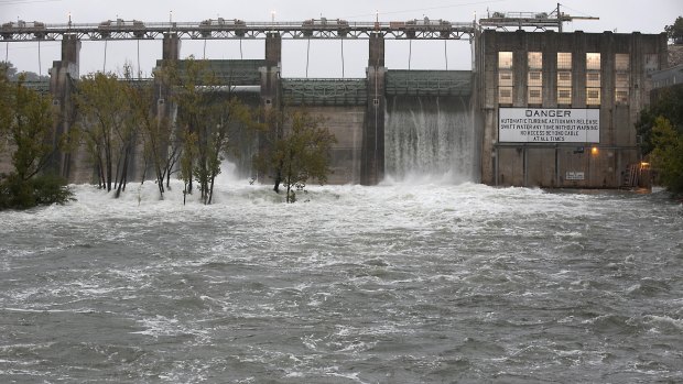 The floodgates at Tom Miller Dam are opened to relieve possible flooding on Lake Austin in Austin, Texas.