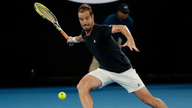 Stretched: Richard Gasquet moves for a forehand on the baseline.