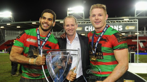 Good times: Greg Inglis, John Maguire and George Burgess pose with the World Club Challenge trophy in February.