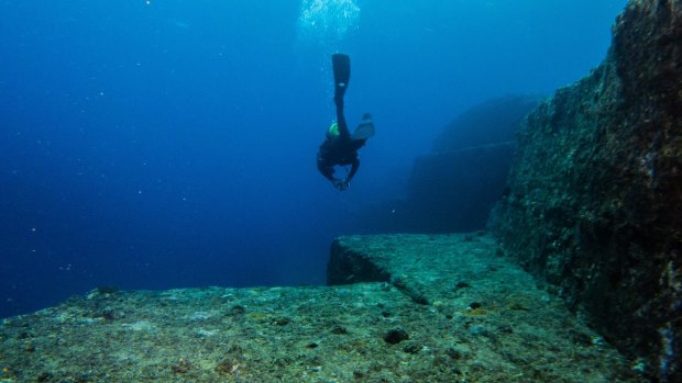 A diver explores the formation known as the Yonaguni Monument.
