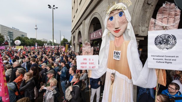 In 2016, protesters demonstrate against the free trade agreements with a giant puppet in Berlin, Germany. 