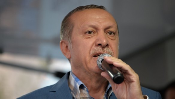 Turkish President Recep Tayyip Erdogan delivers a speech to his supporters in Istanbul after the failed coup.