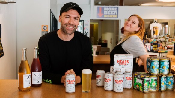 Cameron Walsh, co-owner of Winona bottle shop in Manly, with some of his growing selection of non-alcoholic beer and wine.