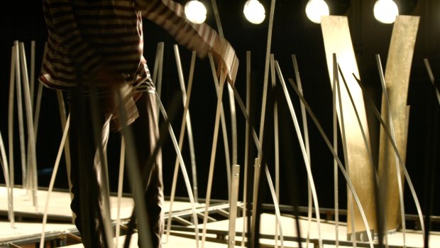 Pole dancing: A performer negotiates a moving floor in Ashley Dyer's <i>Tremor</i>.