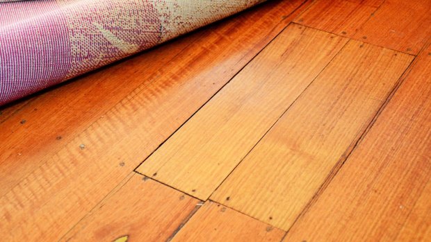 What caused these two floorboards to break during a dinner party at Manning Clark House?