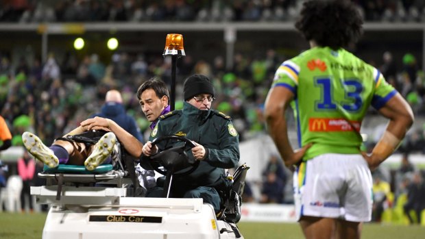 Hit man: Iosia Soliola looks on as Billy Slater is taken from the field.