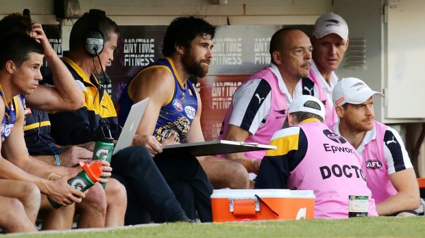 Josh Kennedy is checked by the doctor against GWS.