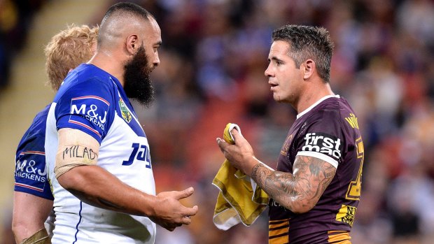 Tense exchange: Sam Kasiano and Corey Parker after the Brisbane captain appeared to be kicked in the face by the Bulldogs forward after a tackle.