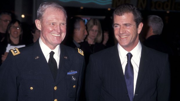 Lieutenant-General Harold G. Moore and actor Mel Gibson attend the We Were Soldiers premiere in 2002.