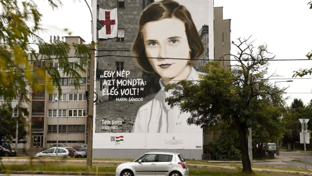 A mural to mark the upcoming 60th anniversary of the Hungarian revolution and freedom fight against Soviet oppression in 1956 adorns the wall of an apartment house in Budapest, Hungary,