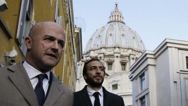 Italian journalists Gianluigi Nuzzi, left, and Emiliano Fittipaldi, leave Vatican City.