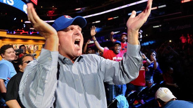 Clippers owner Steve Ballmer greets the fans as he is introduced at their home court at  Staples Center in Los Angeles.