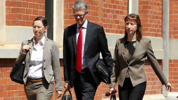 Enigmatic clan: Michael Wright's daughters Alexandra Burt (at left) and Leonie Baldock with solicitor Ben Luscombe.