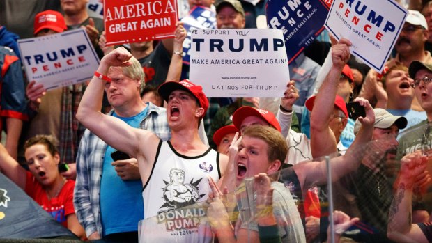 Ardent supporters: Fans cheer for Republican presidential candidate Donald Trump at a rally in Wilkes-Barre, Pennsylvania.